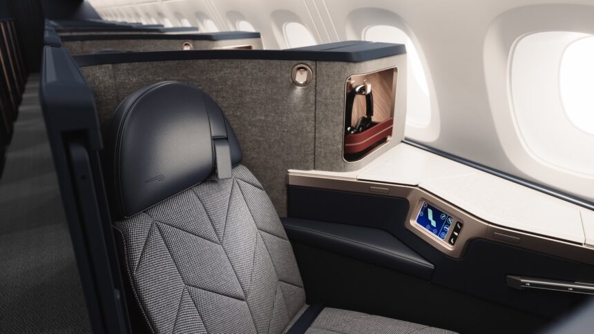 A British Airways Airbus A380 Club suite with sleek black seating featuring a cosy nook for privacy.