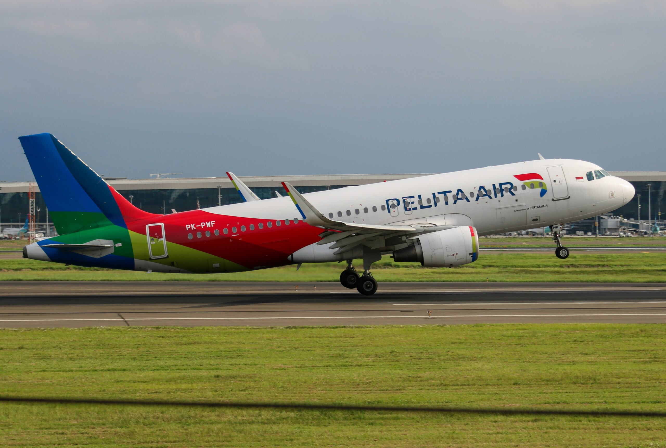 Pelita Air plane taking off in a runway