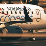 Close-up view of an Aeromexico Connect aircraft during takeoff at airport runway.