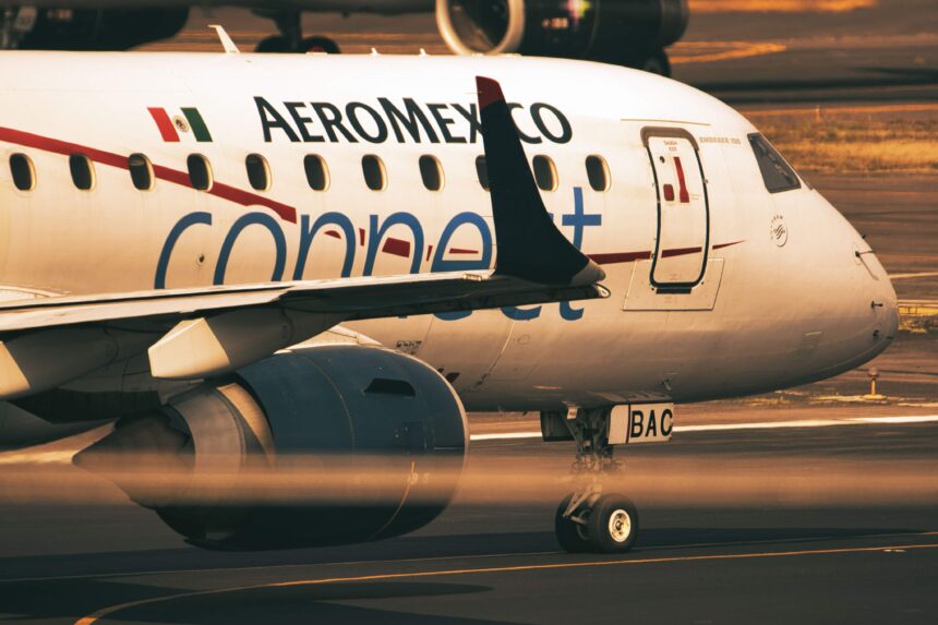 Close-up view of an Aeromexico Connect aircraft during takeoff at airport runway.