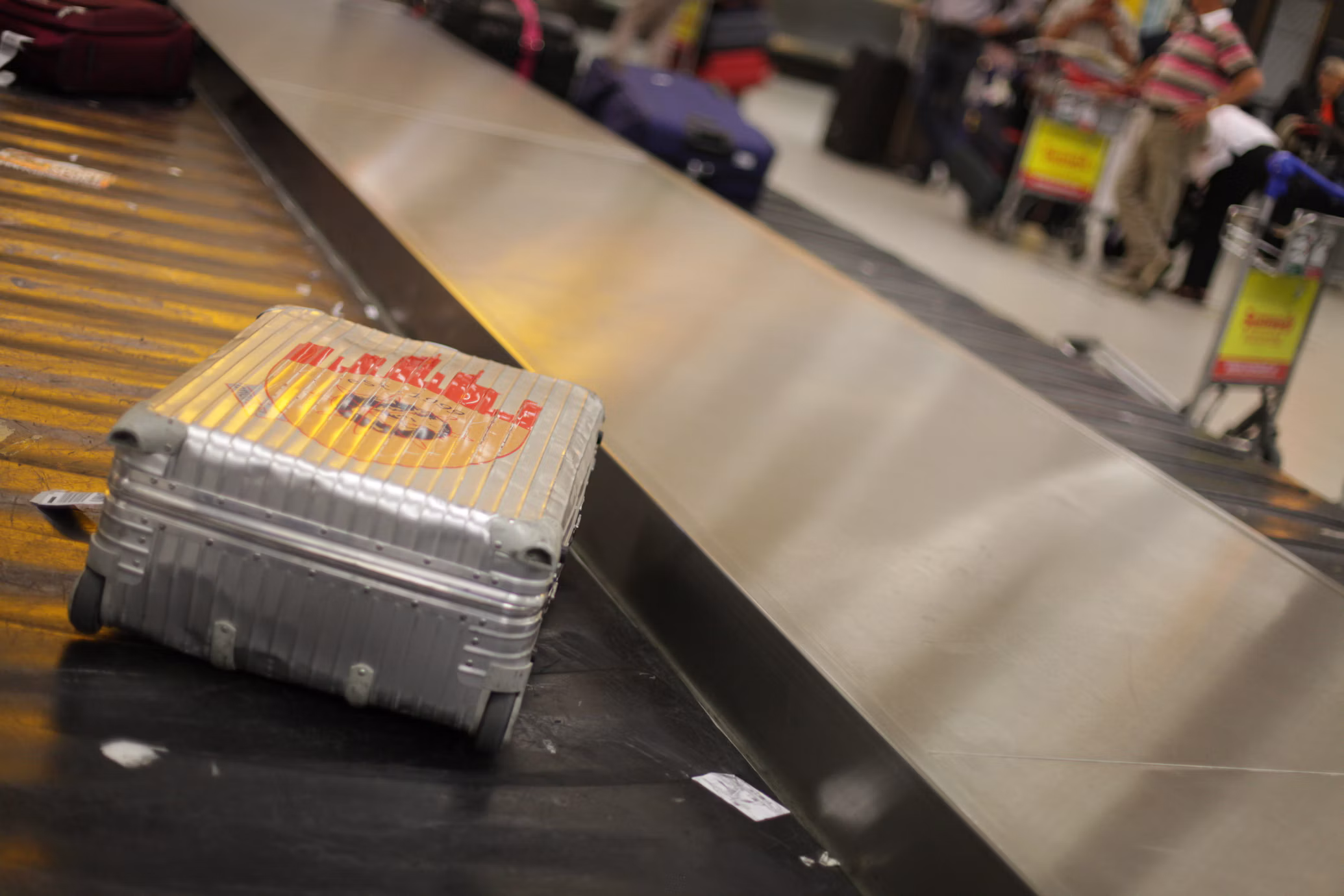 Close-up photo of a grey coloured suitcase in Frankfurt am Main Airport (FRA) baggage area 