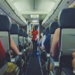 Image of cabin isle where passengers are sat in their seats, listening to the cabin crew. 2017 © Quilia