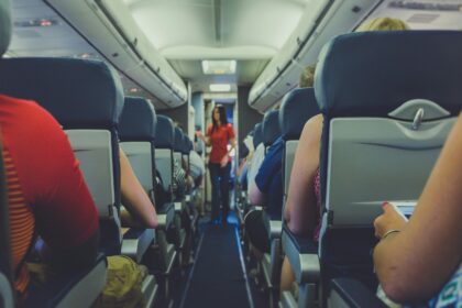 Image of cabin isle where passengers are sat in their seats, listening to the cabin crew. 2017 © Quilia