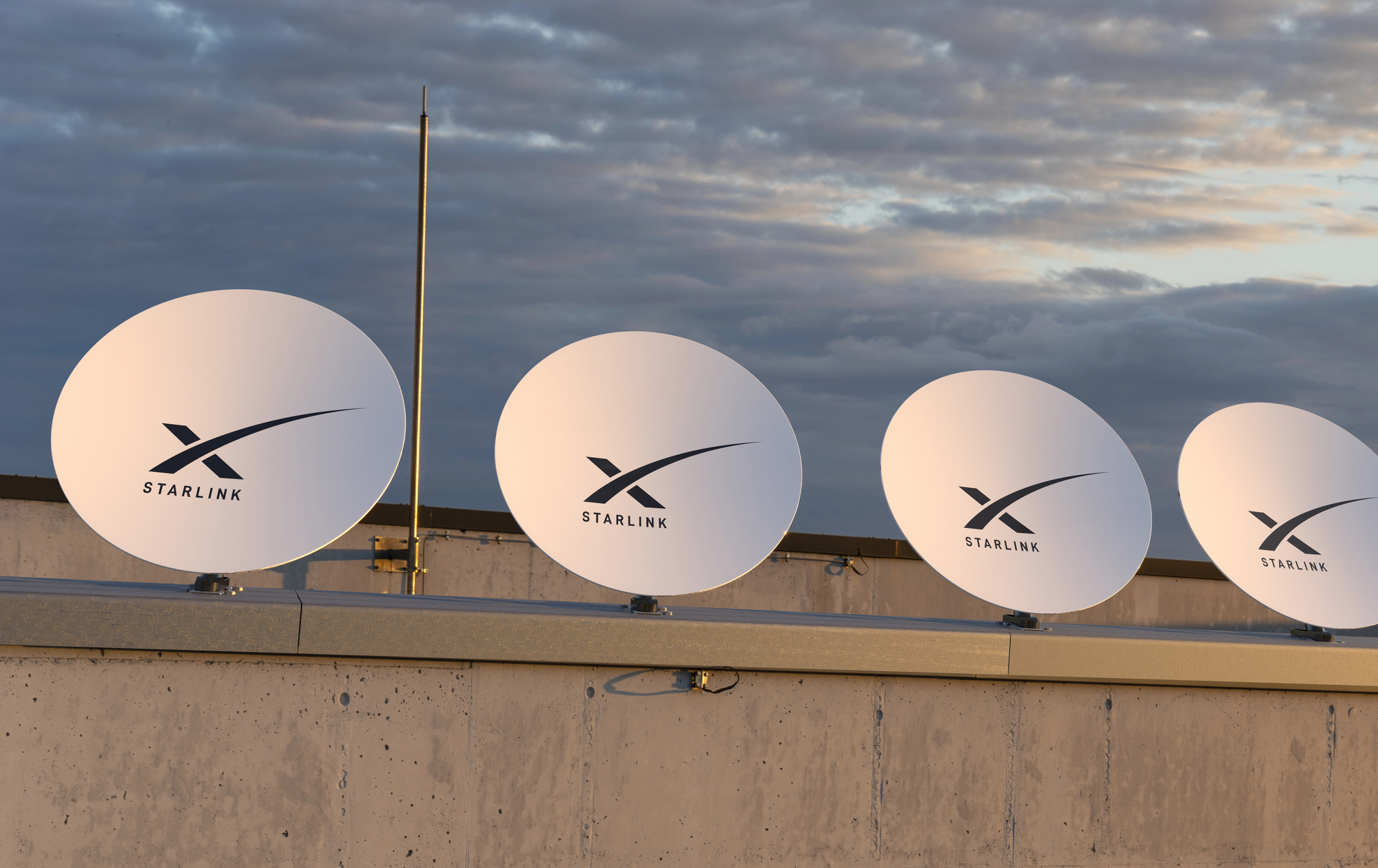 Starlink Satellite dishes in a row © MikeMareen https://depositphotos.com/home.html