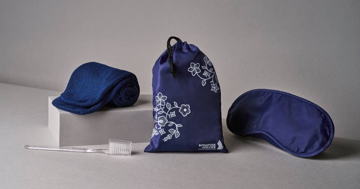 Singapore Airlines' new amenity kit for economy class, featuring a new drawstring pouch, eye mask, socks and dental kit.