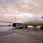 Photograph depicting an Etihad aircraft on the airport runway.